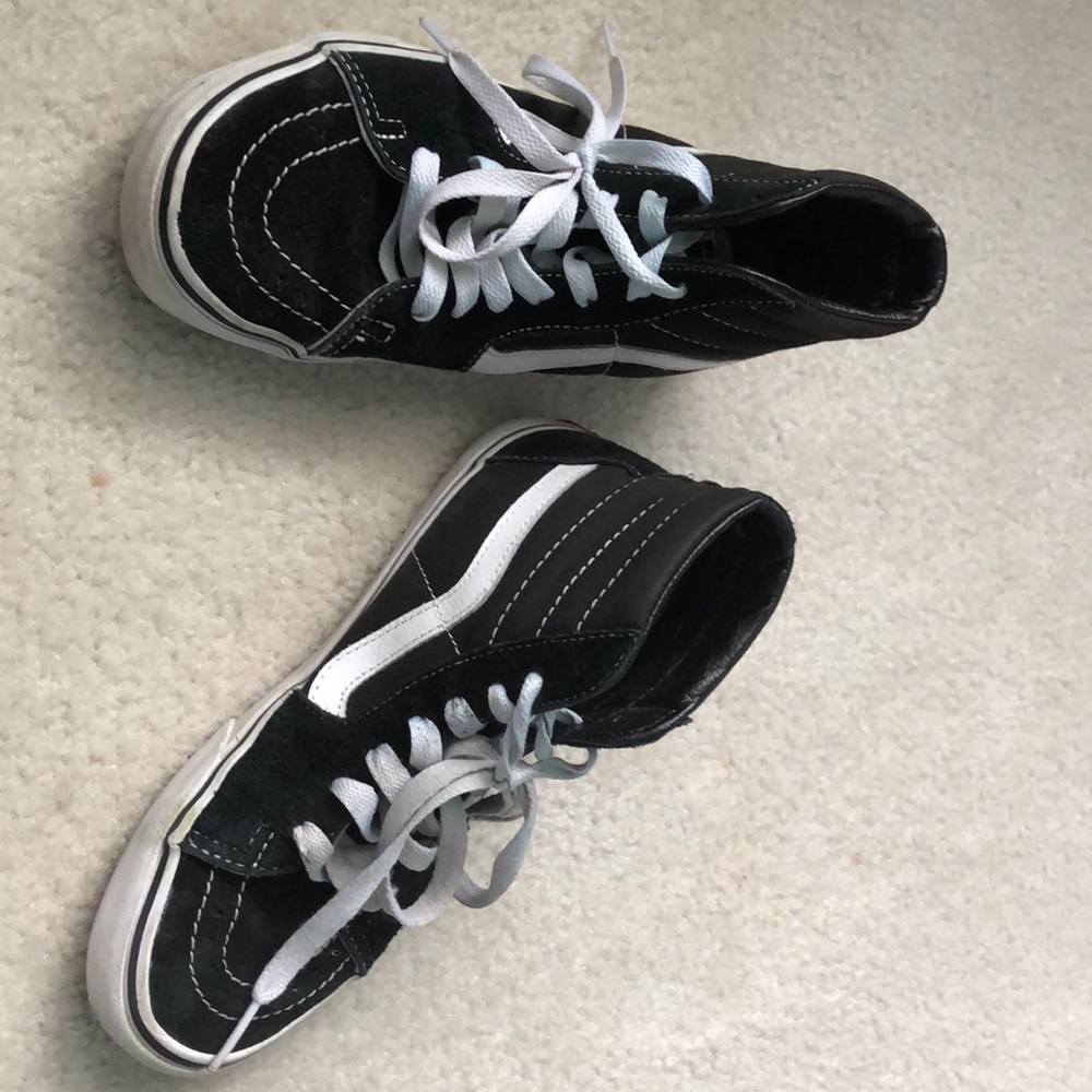 Black and white high top vans